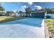 Charming single-story home with long driveway and landscaping at 1438 S Hillcrest Ave, Clearwater, FL 33756