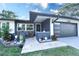 Beautifully landscaped front porch with outdoor seating at 1438 S Hillcrest Ave, Clearwater, FL 33756