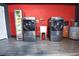 Laundry Room with a drink refrigerator, wash sink and red accent wall at 1438 S Hillcrest Ave, Clearwater, FL 33756