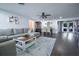 Open concept living room and dining area with dark wood floors and natural light at 1438 S Hillcrest Ave, Clearwater, FL 33756