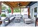 Cozy outdoor patio with brick flooring, a ceiling fan, and comfortable outdoor seating at 1438 S Hillcrest Ave, Clearwater, FL 33756