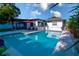Sparkling pool surrounded by a patio, perfect for relaxation and outdoor entertaining by the house at 1438 S Hillcrest Ave, Clearwater, FL 33756