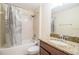 Bathroom featuring granite counters, wood cabinets, a toilet, bathtub and shower at 16616 Magnolia Reserve Pl, Wimauma, FL 33598