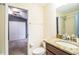 Bathroom featuring granite counters, wood cabinets, a toilet and shower with glass door at 16616 Magnolia Reserve Pl, Wimauma, FL 33598