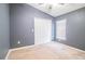 Neutral bedroom with carpet flooring, ample closet space, and a bright window at 16616 Magnolia Reserve Pl, Wimauma, FL 33598