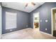 Bedroom featuring carpet floors, window for natural light, and ensuite bathroom access at 16616 Magnolia Reserve Pl, Wimauma, FL 33598