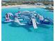 Aerial view of an aqua park with inflatable structures and water slides at 16815 Trite Bend St, Wimauma, FL 33598