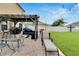 Well-designed backyard with a dining area, lounge chairs, and a relaxing pergola at 16815 Trite Bend St, Wimauma, FL 33598