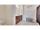 Bathroom with double vanity, tiled floor, and modern fixtures at 16815 Trite Bend St, Wimauma, FL 33598