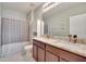 This is a clean bathroom with double sinks, marble countertops, and a shower at 16815 Trite Bend St, Wimauma, FL 33598