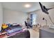 Functional bedroom space with natural light and room for relaxation and productivity at 16815 Trite Bend St, Wimauma, FL 33598