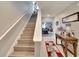 Bright hallway with stairs and views of the dining room table at 16815 Trite Bend St, Wimauma, FL 33598