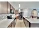 Bright kitchen with sleek countertops, modern appliances, and an open layout for easy movement at 16815 Trite Bend St, Wimauma, FL 33598