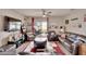 Cozy living room boasts stylish decor, comfortable seating, and access to the outdoor patio at 16815 Trite Bend St, Wimauma, FL 33598