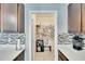 Spacious pantry conveniently located off the kitchen with tiled floor and shelving for organized storage at 16815 Trite Bend St, Wimauma, FL 33598