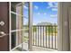 Cozy balcony view featuring black metal railing and view of neighborhood homes at 1796 Tonka Ter, Wesley Chapel, FL 33543