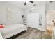 Cozy bedroom showcases wood-look floors, ceiling fan, and closet at 1796 Tonka Ter, Wesley Chapel, FL 33543
