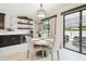 Eat-in kitchen with table and bar, stainless steel appliances, with access to backyard at 1796 Tonka Ter, Wesley Chapel, FL 33543