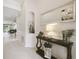 Elegant foyer with hardwood floors, decorative lighting, and stylish decor at 1796 Tonka Ter, Wesley Chapel, FL 33543