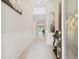 Bright and airy foyer with hardwood floors and decorative accents at 1796 Tonka Ter, Wesley Chapel, FL 33543