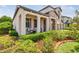 Charming home with a welcoming front porch, stone accents, and lush landscaping at 1796 Tonka Ter, Wesley Chapel, FL 33543