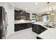 Modern kitchen with dark cabinets, stainless steel appliances, and stylish backsplash at 1796 Tonka Ter, Wesley Chapel, FL 33543