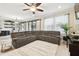 Comfortable living area showcases a large sectional sofa and seamless access to the outdoor space at 1796 Tonka Ter, Wesley Chapel, FL 33543