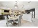 Open-concept living space features a dining area, kitchen with stainless steel, and a cozy living room at 1796 Tonka Ter, Wesley Chapel, FL 33543
