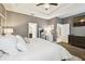 Serene main bedroom boasts a tray ceiling, neutral colors, and access to the ensuite bathroom at 1796 Tonka Ter, Wesley Chapel, FL 33543