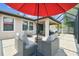 Beautiful screened patio with comfortable seating, a hanging chair, and outdoor entertaining space at 1796 Tonka Ter, Wesley Chapel, FL 33543