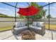 Cozy patio area with comfortable seating, perfect for enjoying outdoor moments with a fire pit at 1796 Tonka Ter, Wesley Chapel, FL 33543