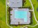 Overhead view of a sparkling community pool with lounge chairs and lush greenery, offering a refreshing retreat at 1796 Tonka Ter, Wesley Chapel, FL 33543