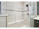 Tiled shower boasts a built-in bench and sleek fixtures for a spa-like experience at 1796 Tonka Ter, Wesley Chapel, FL 33543
