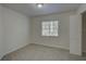 Bedroom featuring neutral carpet, a window with blinds, and a closet at 18918 Emerald Ridge Dr, Hudson, FL 34667