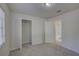 Bedroom with neutral carpet and closet with view to doorway leading to an en-suite bathroom at 18918 Emerald Ridge Dr, Hudson, FL 34667