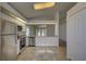 Open-concept kitchen featuring stainless steel appliances and an open view to the backyard at 18918 Emerald Ridge Dr, Hudson, FL 34667