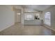 Spacious living room featuring neutral colors, tile floors and access to the backyard at 18918 Emerald Ridge Dr, Hudson, FL 34667