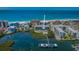 Aerial view of condo building and boat slips with Gulf access and beach access at 19519 Gulf Blvd # 203, Indian Shores, FL 33785