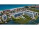 Aerial view of beachfront condos with boat access, beach access, and community pool at 19519 Gulf Blvd # 203, Indian Shores, FL 33785