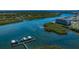 Stunning aerial view showcasing waterfront property, mangroves, and beautiful blue waterways; a scenic and idyllic location at 19519 Gulf Blvd # 203, Indian Shores, FL 33785