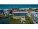 Aerial view of a beachfront condo building with a pool and easy beach access at 19519 Gulf Blvd # 203, Indian Shores, FL 33785