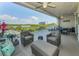 Spacious covered balcony with comfortable seating and views of the bay at 19519 Gulf Blvd # 203, Indian Shores, FL 33785