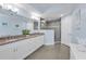 Charming primary bathroom with double vanity, granite countertop, and glass shower at 19519 Gulf Blvd # 203, Indian Shores, FL 33785