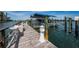 Private boat dock with boat lift, cleaning station and idyllic nautical theme at 19519 Gulf Blvd # 203, Indian Shores, FL 33785