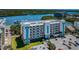 Exterior view of condo building showcasing its architecture, balconies, and waterfront location at 19519 Gulf Blvd # 203, Indian Shores, FL 33785