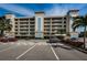 Well-maintained building with lush landscaping, dedicated parking and timeless design at 19519 Gulf Blvd # 203, Indian Shores, FL 33785
