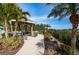 Charming gazebo surrounded by lush landscaping, providing a serene outdoor seating area for relaxing and socializing at 19519 Gulf Blvd # 203, Indian Shores, FL 33785