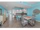 Kitchen connected to the dining room featuring a breakfast bar and open layout at 19519 Gulf Blvd # 203, Indian Shores, FL 33785