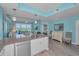 Spacious kitchen with large island, stainless steel appliances, and easy access to the living area at 19519 Gulf Blvd # 203, Indian Shores, FL 33785