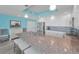 Open kitchen featuring granite countertops, island seating, and modern stainless steel appliances at 19519 Gulf Blvd # 203, Indian Shores, FL 33785